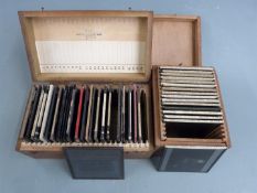 Sixteen Royal Astronomical Society slides, mainly showing nebulae together with a case of similar