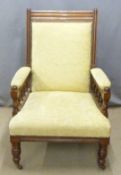 Large 19thC mahogany framed upholstered armchair raised on turned legs and castors, W72 x H104cm