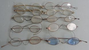 Ten pairs of Georgian and later spectacles, most having steel frames, one marked Pebbles with lion
