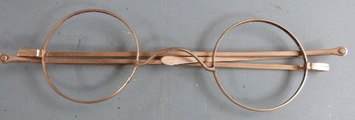 Pair of Georgain or early Victorian rolled gold spectacles, width when closed 10.5cm