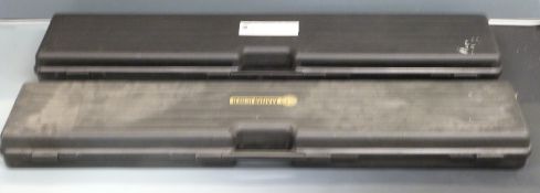 Two Manlicher rifle hard carry cases with padded interiors, 123 x 26 x 11cm.