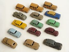 Fifteen Dinky Toys diecast model cars including Studebaker, Austin Somerset, Morris Oxford, Ford
