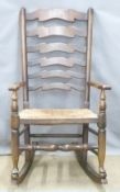 A rush seated ladderback rocking chair