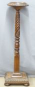 A 19thC mahogany jardiniere stand with rope twist support and carved base, H 123cm