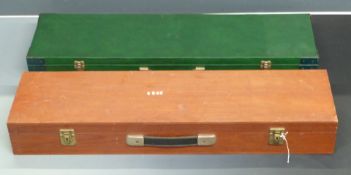 Two shotgun cases one with fitted interior and metal bound corners (82 x 23 x 8.5cm) the other