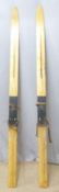 A pair of vintage ash skis with leather bindings, L2m