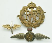 Royal Air Force cap badge, medal and enamel brooch and a winged propeller pin badge marked '