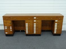 Shopfitting / haberdashery mahogany double twin pedestal desk with veneered top, the desk with an