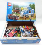 Two Lego building sets Police Dog Van 4441 (2012) and Excavator Transporter (2012), both in original