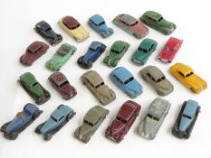 Twenty-three Dinky Toys diecast model cars including Hudson Sedan, Chrysler, Triumph, Vanguard,