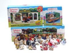 A collection of Tomy Sylvanian Families figures, buildings and accessories including Canal Boat,