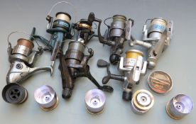 A collection of fixed spool coarse and sea fishing reels and spare spools including Sigma, Silver