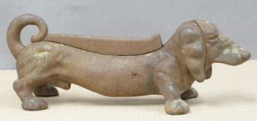 A cast iron boot scraper in the form of a Dachshund, length 37cm