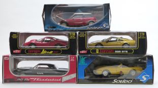 Five 1:18 scale diecast model cars comprising three Anson Ford Thunderbird, Ferrari Dino 246GT and