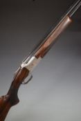 Browning B2G 12 bore over and under ejector shotgun with engraved scenes of birds to the lock,