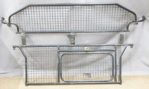 Dog divider/guard for a Land Rover