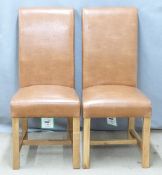 A pair of upholstered oak chairs, new and unused