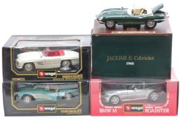 Four Burago 1:18 scale diecast model sports cars comprising BMW M Roadster 1996 3369, Jaguar E