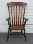 A 19thC/20thC elm seated Windsor armchair, W62 x H105cm