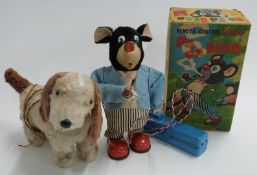 Two Japanese tinplate battery operated remote control toys Marusan (San) Smoking Pa Pa Bear in