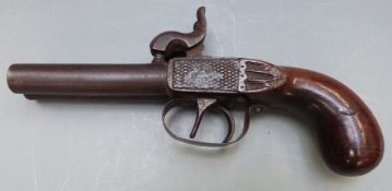 Double barrelled side by side percussion hammer action pistol with carved wooden grip shaped hammers