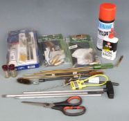 A collection of shotgun and rifle cleaning kit and accessories including Napier pull through kits,
