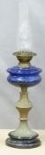 Wright & Butler oil lamp with blue glass reservoir, Height 68cm