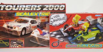 Two Hornby Scalextrix model motor racing sets Tourers 2000 C.673 and Micro Scalextric The Simpsons