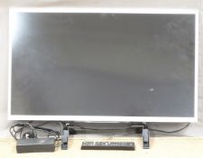 Sony flatscreen television, stand and accessories