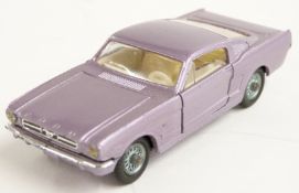 Corgi Toys diecast model Ford Mustang Fastback 2+2 with silver body, cream interior and Corgi on