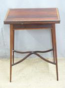 Rosewood fold over card table with inlaid decoration raised on tapering legs with swept inlaid