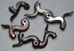 Six percussion gun hammers including two pairs, all with engraved decoration, some in the form of