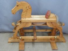 A wooden rocking horse, H75cm
