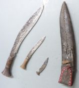 Kukri knife with crude etching to 31cm blade, with Karda and Chakmak, in leather sheath