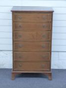 Mahogany chest of six drawers with inlaid decoration and ring handles, raised on bracket feet, W58 x