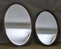 Two oval bevelled glass mirrors, one with inlaid frame, largest 65 x 95cm