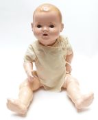 Heinrich Handwerke composite doll with open mouth, weighted brown eyes and jointed limbs, marked