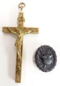 German WW1 brass and wood crucifix, H13cm, together with a metal mound badge
