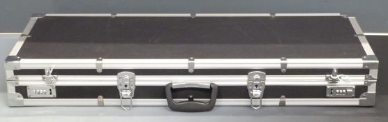 A shotgun or rifle flight case with coded lock, 91x36x13cm.
