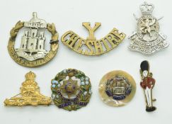 Six British Army badges for the Essex Regiment, Royal Sussex Regiment, Cheshire Yeomanry etc