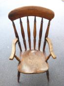 An elm seated Windsor armchair, H116cm
