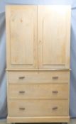 A 19th/20thC two part pine housekeeper's cupboard over a chest of three straight drawers with four