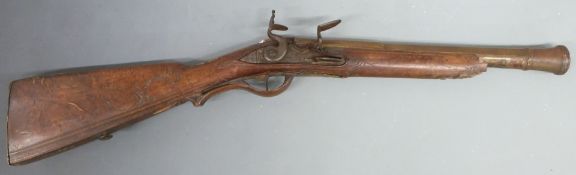 Flintlock brass barrelled blunderbuss with lock engraved 'Kohlhas In Pihra', ornately engraved stock