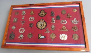 Thirty one mainly British Army badges including Northamptonshire Yeomanry, Royal West Kent, Scots