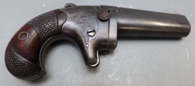 Colt No. 2 .41 rimfire derringer pistol with shaped and chequered grip, engraved decoration,