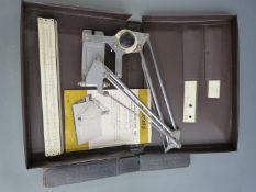 Tecnostyl portable drafting set with instructions, together with an Albert Nestler slide rule in