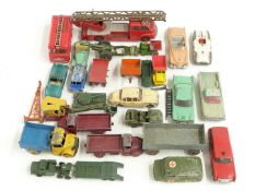 Twenty-five Corgi, Dinky, Matchbox and similar diecast model vehicles including military trucks,