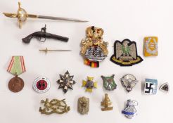 Replica Nazi German badges including enamel examples, novelty Toledo letter opener sword etc