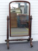 Victorian mahogany cheval mirror with turned stepped and graduated supports and stretcher and