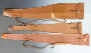 Three canvas and leather shotgun or rifle gun slips including one London Gun Company.